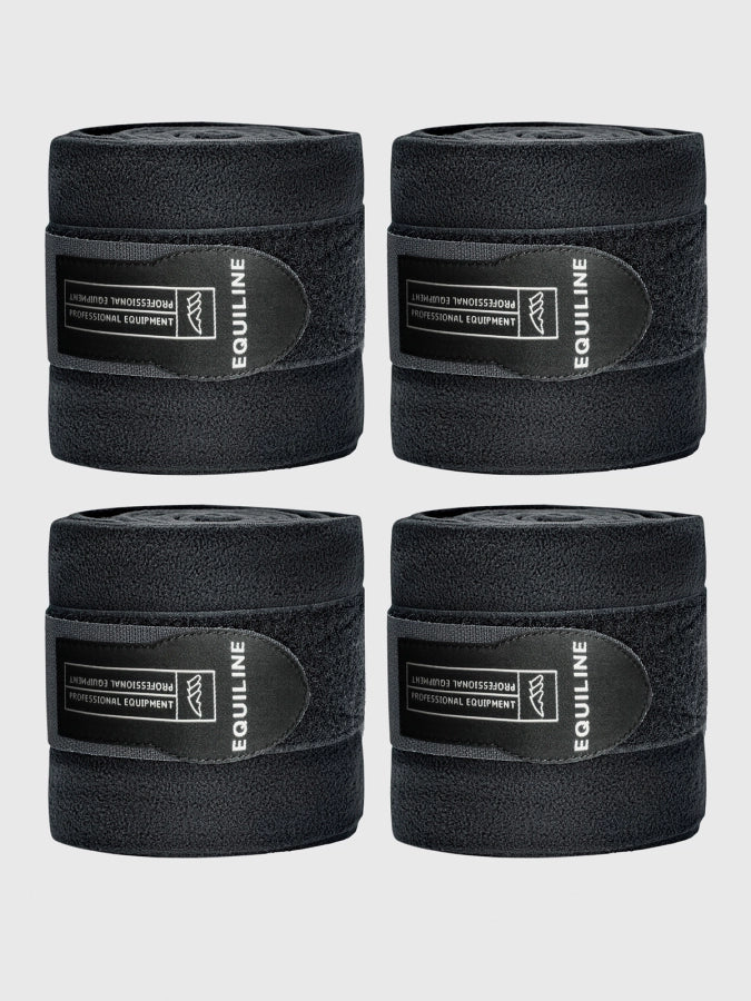 Four rolls of Equiline black bandage on a light gray background