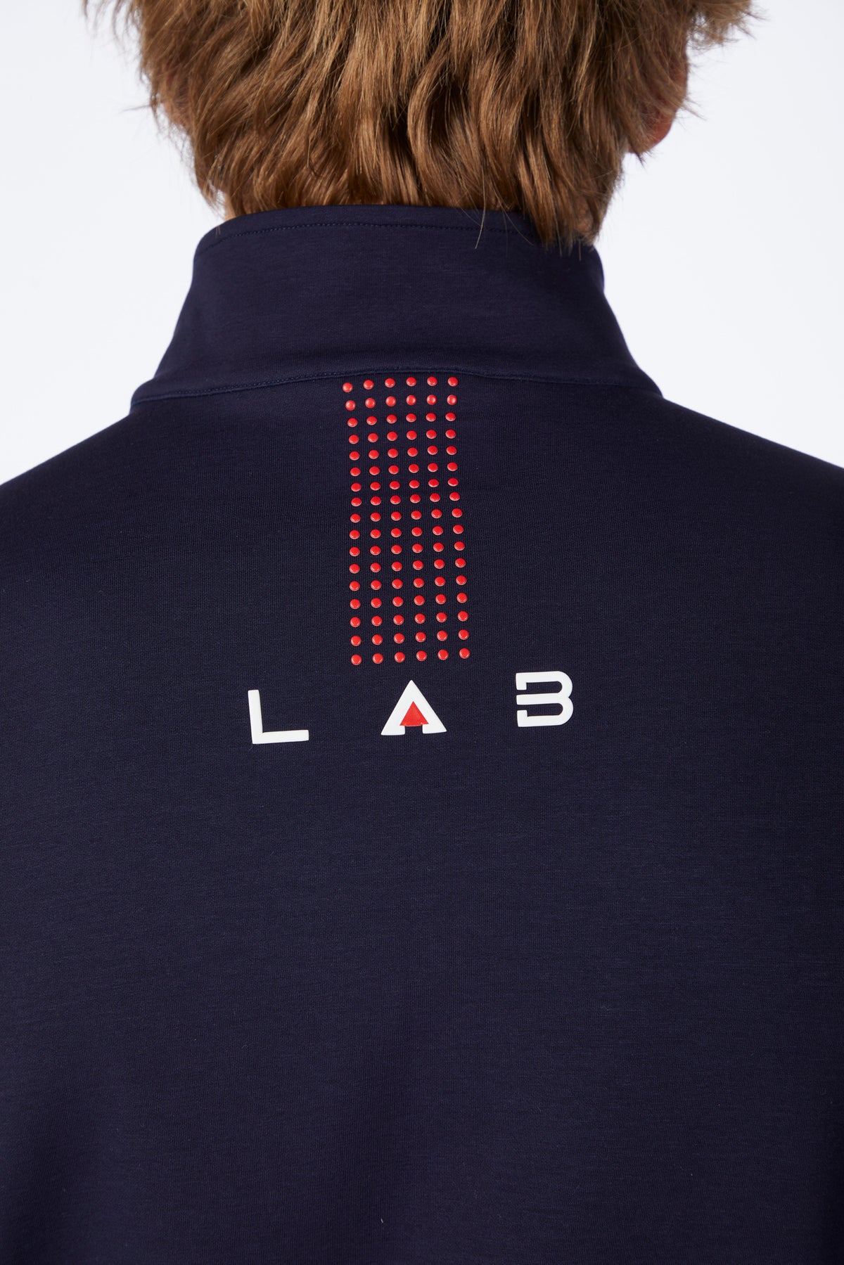 Navy blue jacket with 'LAB' logo on the back against a white background