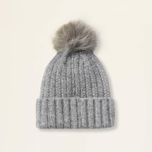 Grey beanie on a beige background
