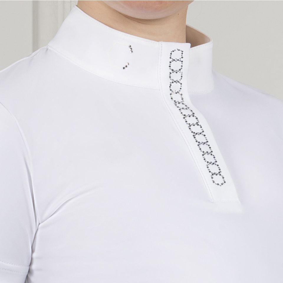 Close-up of a white high-neck athletic top with a decorative black dotted chain-like embellishment running down the front placket.