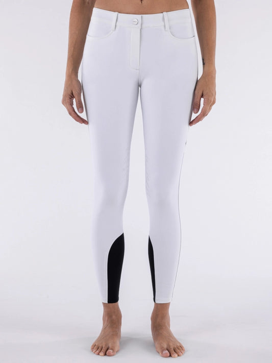 White riding pants with black panels on a white background