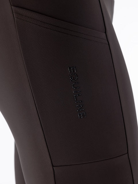 Close-up of dark brown athletic leggings showing a side pocket with the brand name 'EQUILINE' in a subtle dark metallic font.