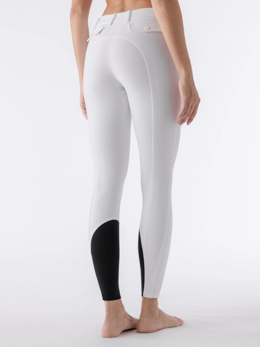 White breeches with black sock bottoms worn by a person on a white background