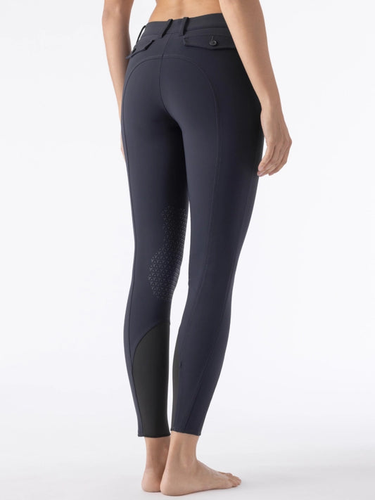 Navy breeches worn by a person on a white background