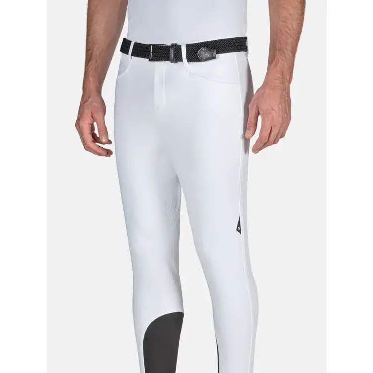man wearing white equiline breeches with logo on a white background