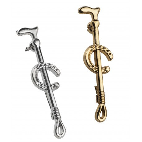 Silver and gold horseshoe and crop stock pins on a white background
