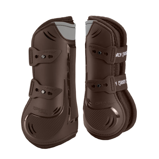 Pair of brown protective horse boots on a white background