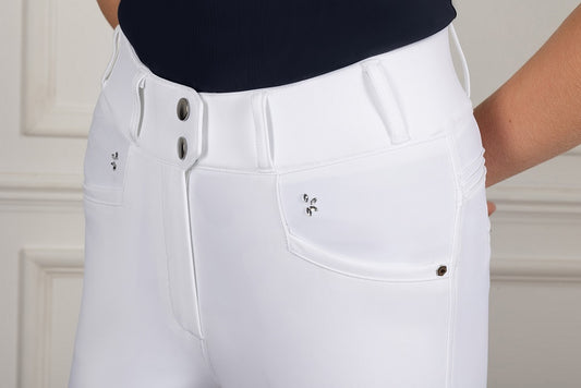 White pants with silver buttons and details on a neutral background