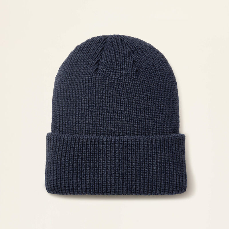 Navy beanie on a beige background