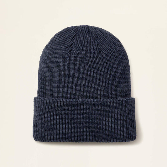 Navy beanie on a beige background