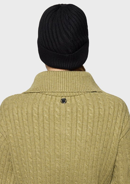 Back view of a person wearing a ribbed olive green cable-knit sweater and a dark burgundy knit beanie against a light gray background.