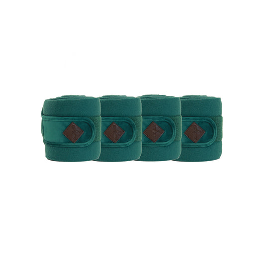 Four green protective wraps with brown diamond pattern on a white background