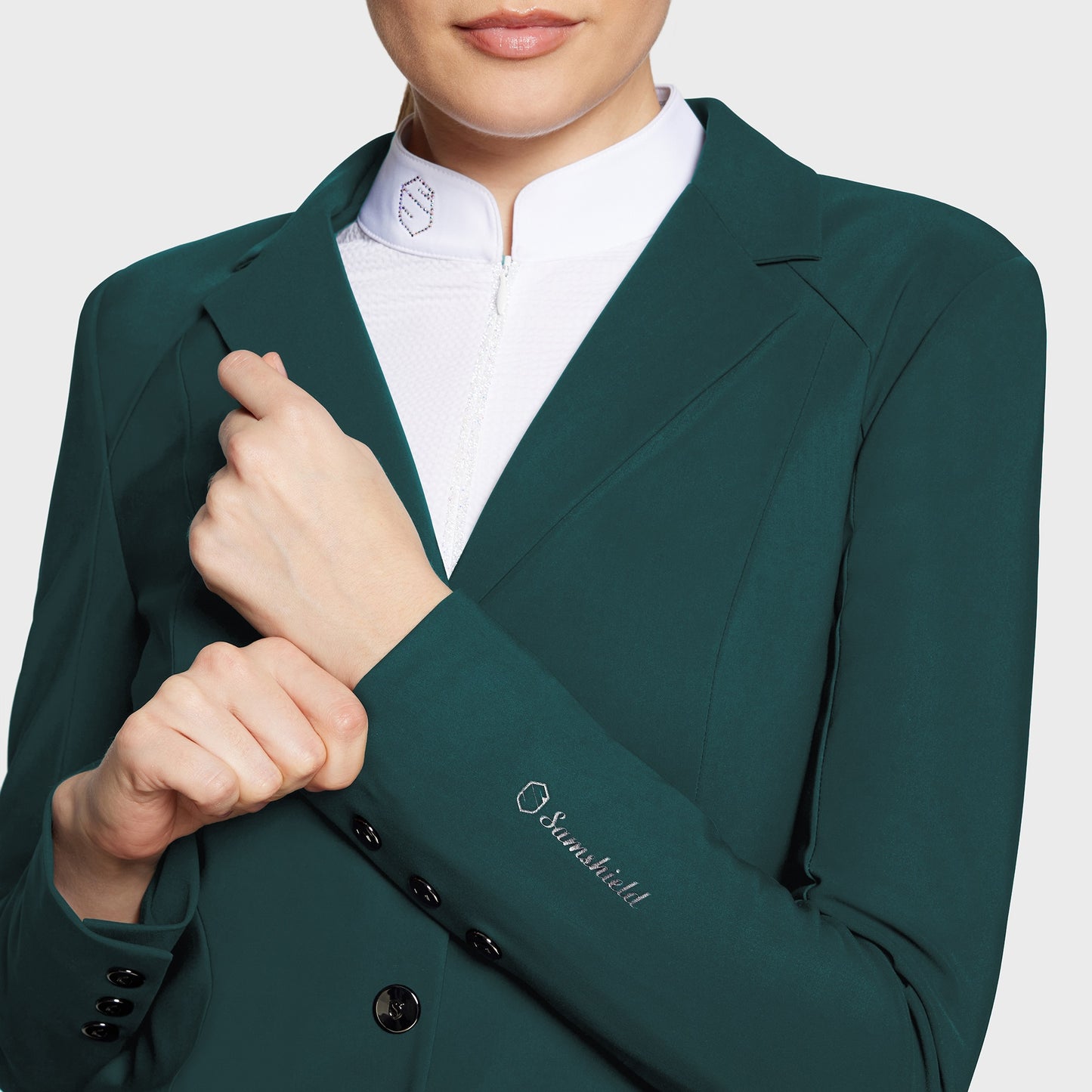 Green blazer with a brand logo on a white background