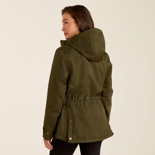 Woman wearing a green hooded jacket on a beige background