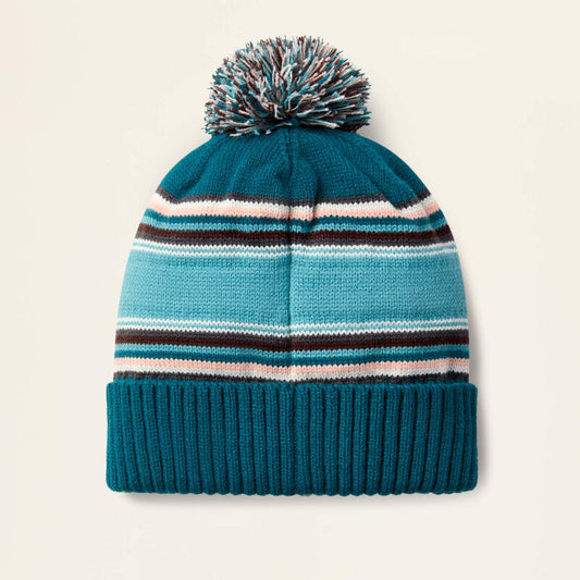 Turquoise beanie on a beige background