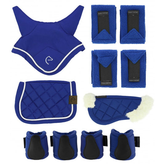 Set of blue equestrian protective gear including a back guard, saddle pad, leg wraps, and boot covers on a white background.