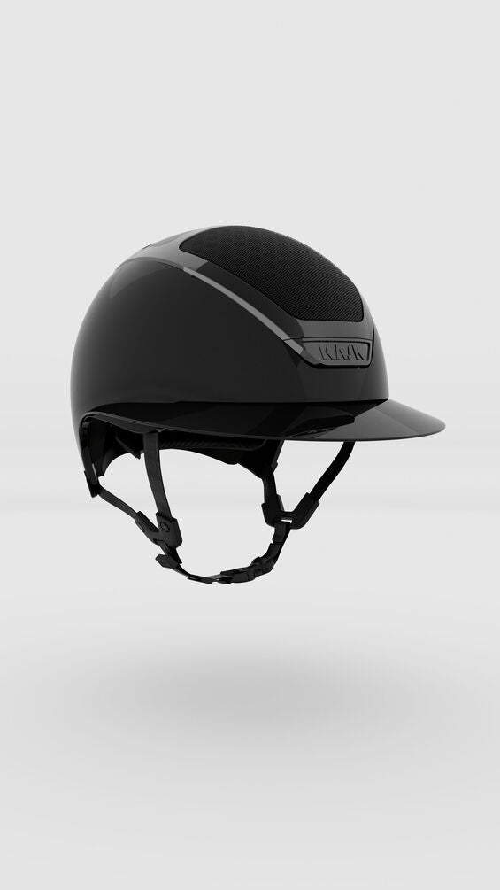 Black riding helmet on a light gray background
