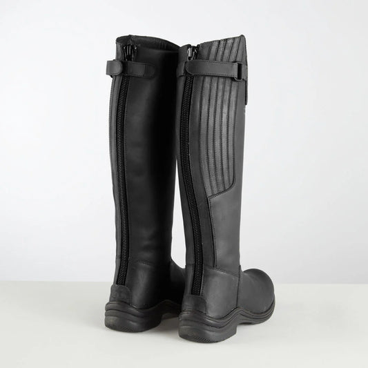 Pair of black long riding boots on a white background