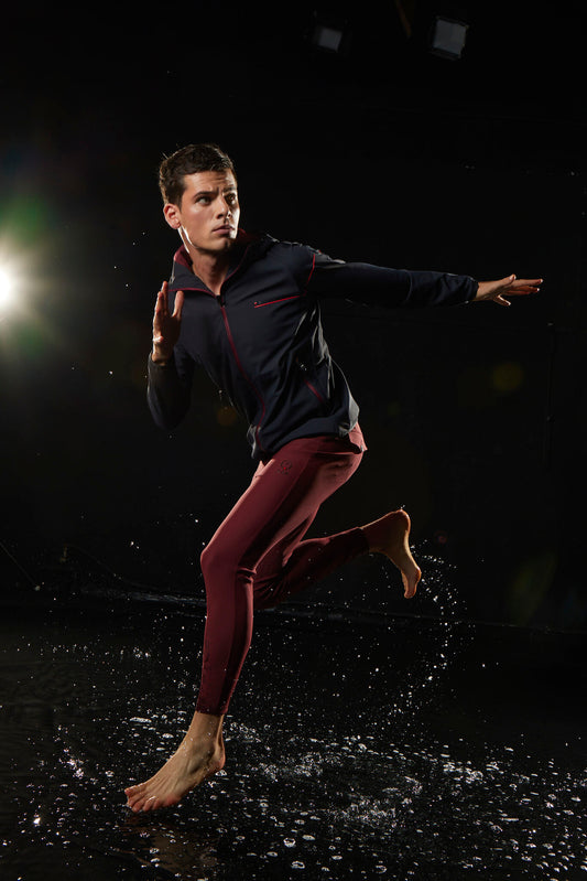 Dancer in a dark setting with a spotlight