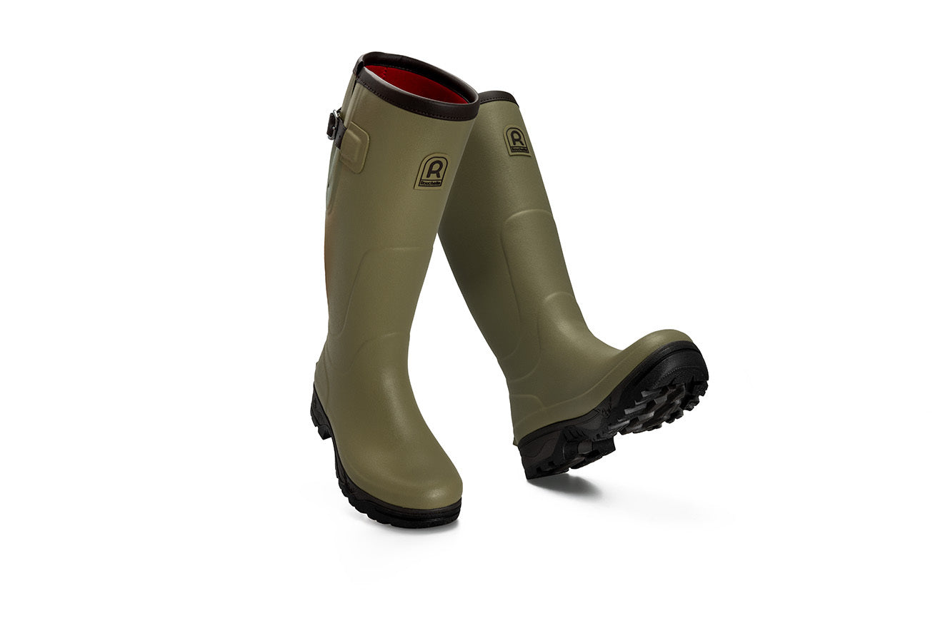 Pair of green rubber boots on a white background