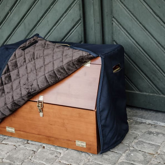 show grooming box with navy fleece lined cover in a stable yard