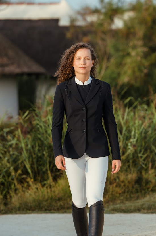 Dark Haired Lady in Navy competition jacket and white breeches 