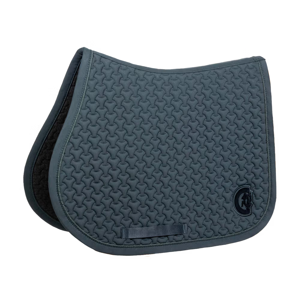 Green saddle pad on a plain background