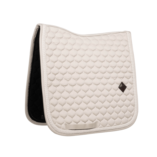 Beige saddlepad on a white background