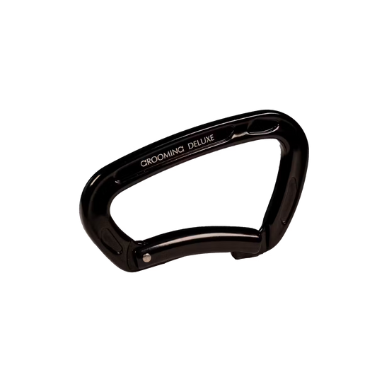 Black clip with 'Grooming Deluxe' branding on a white background