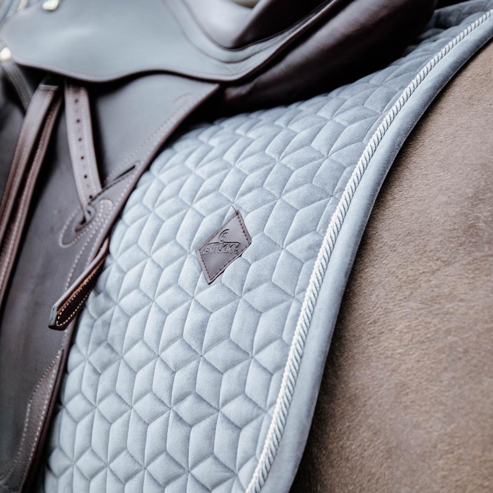 Saddlepad on a horse under a brown saddle