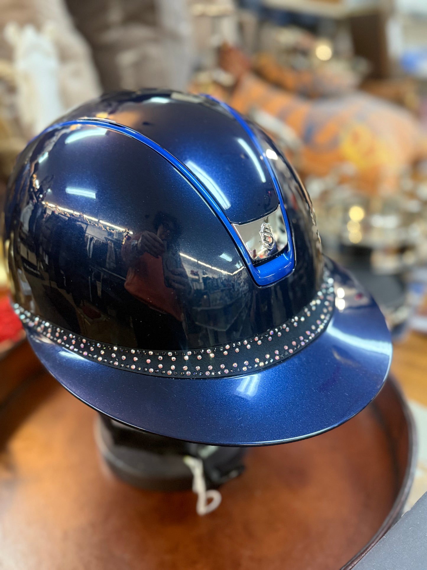 Blue helmet with decorative elements on a blurred background