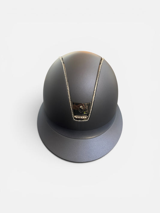 Navy riding helmet with silver trim on a white background