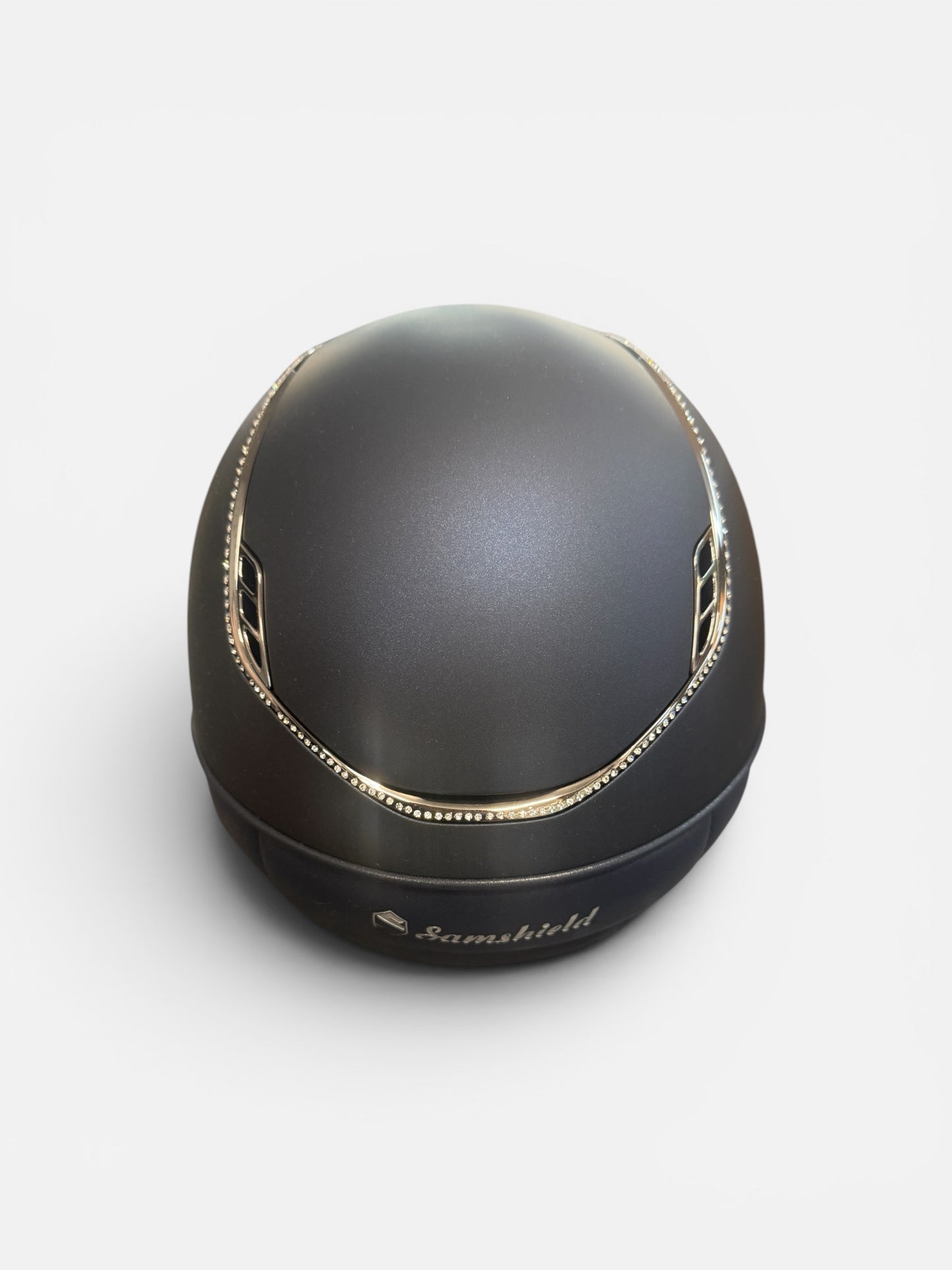 Navy riding helmet with silver trim on a white background