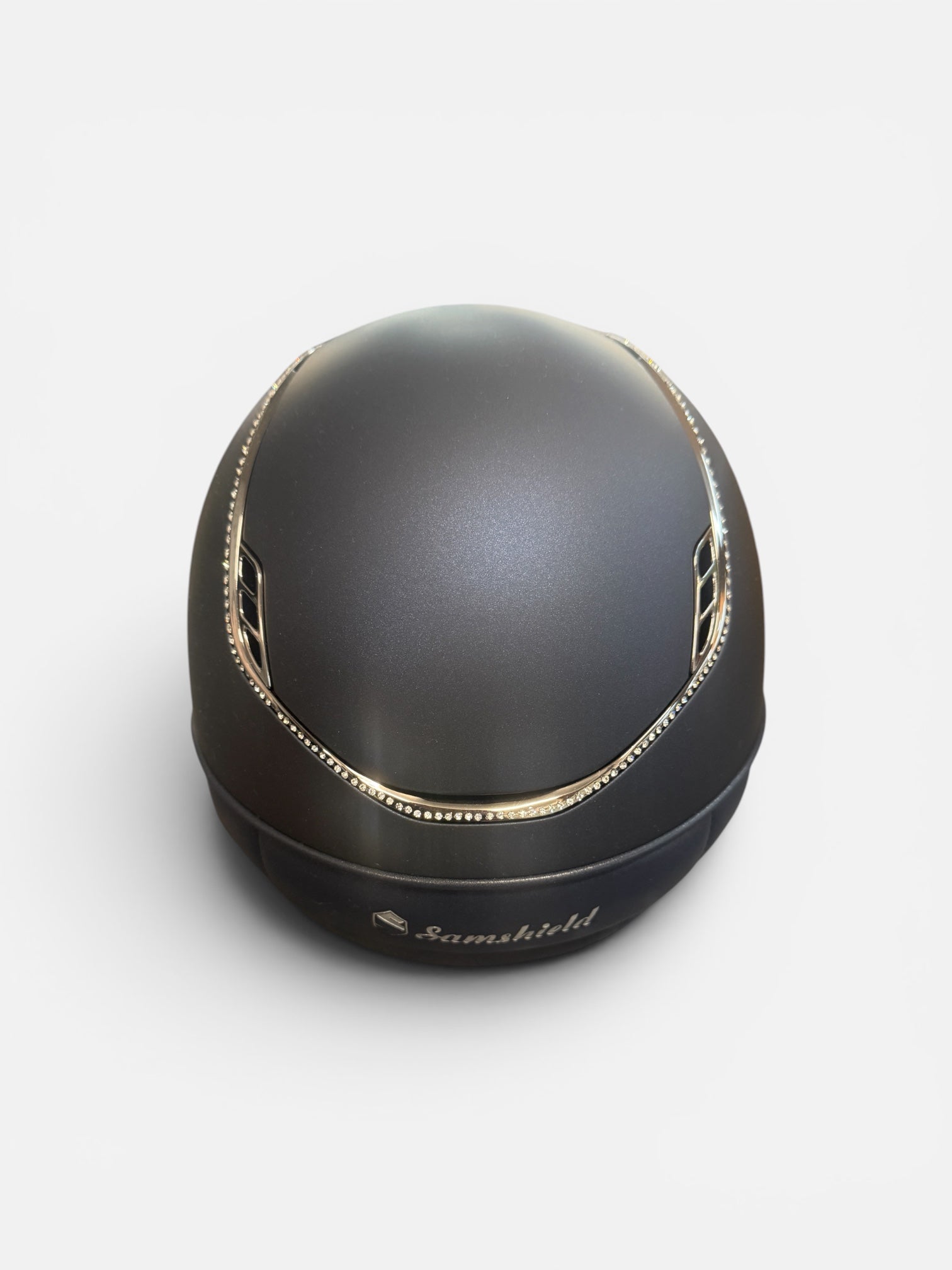 Navy riding helmet with silver trim on a white background