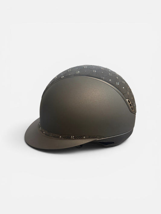 Black helmet with decorative elements on a white background