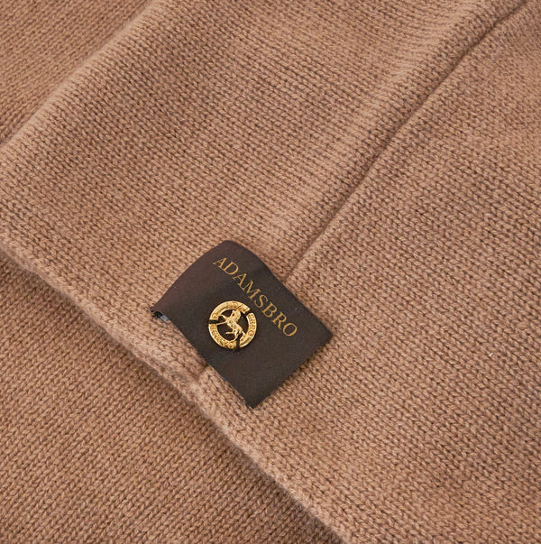 Detail of a camel coloured poncho