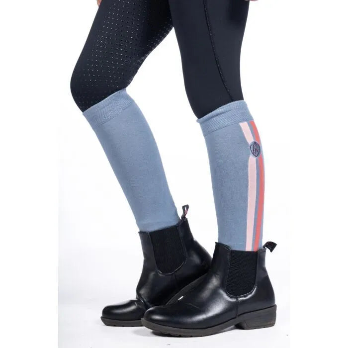 Black boots with light blue socks featuring a red and white stripe on a white background