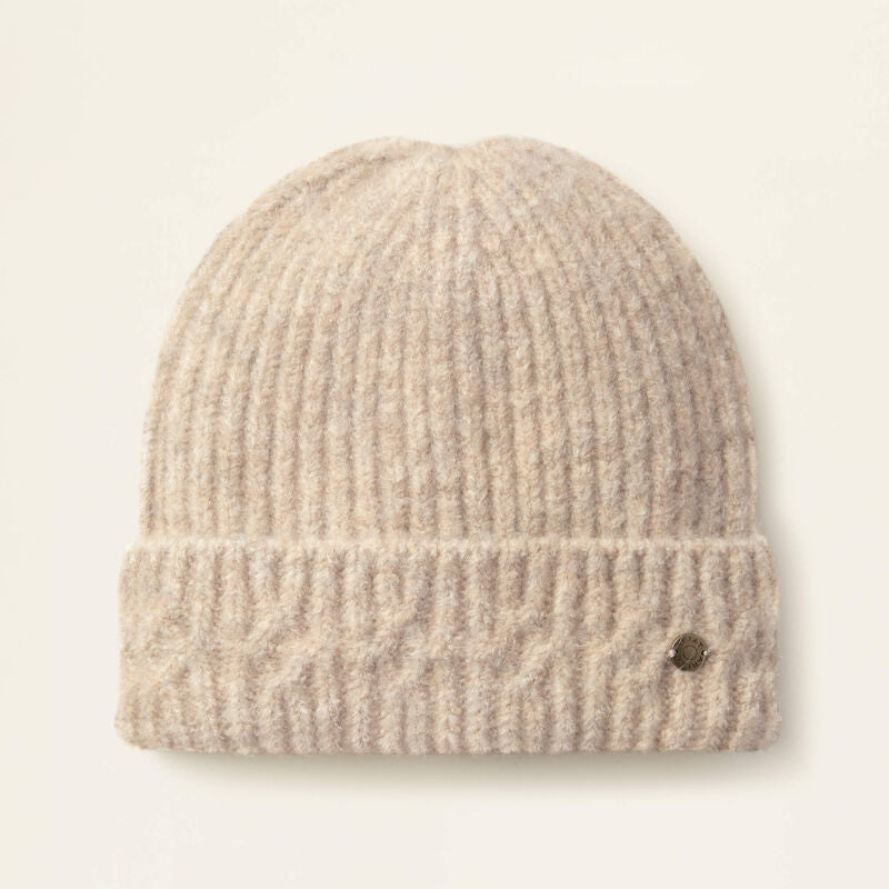 Beige knit beanie on a light beige background