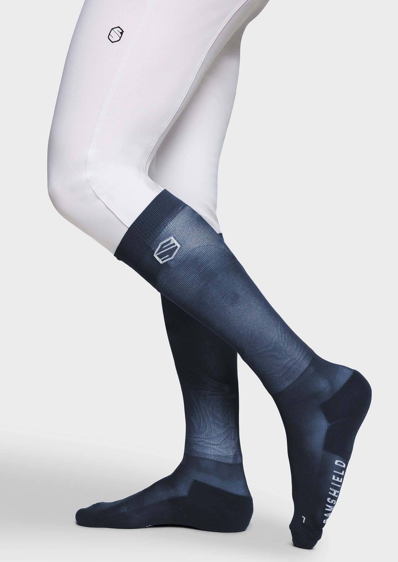 Dark blue compression socks with a brand logo on a white background