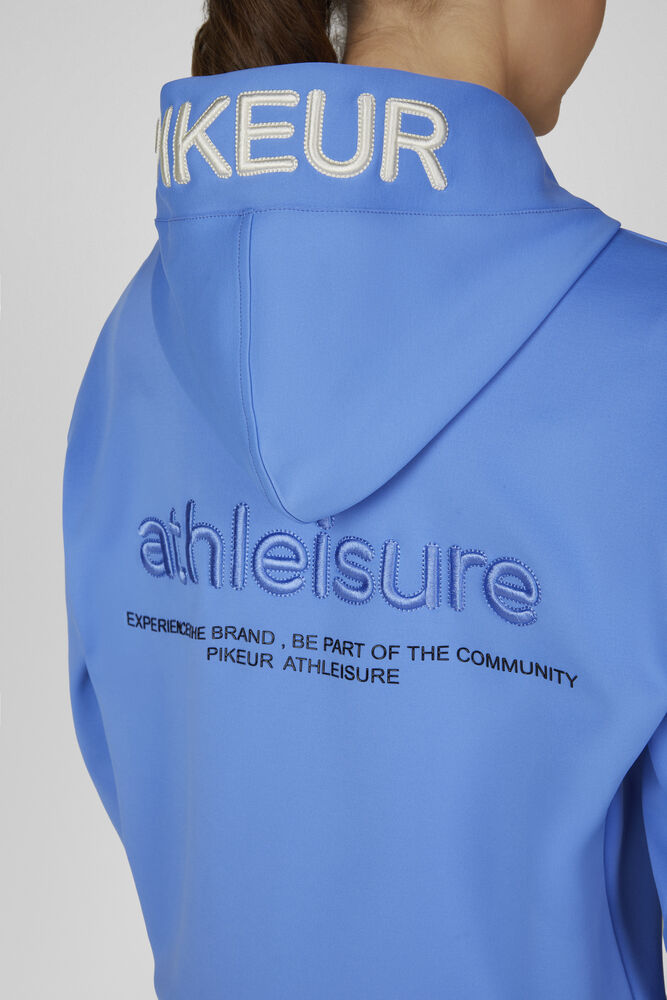 Close-up back view of a person wearing a bright blue Piqueur Athleisure hoodie, showing white embroidered 'PIKEUR' text on the collar and blue embroidered 'athleisure' branding on the back.