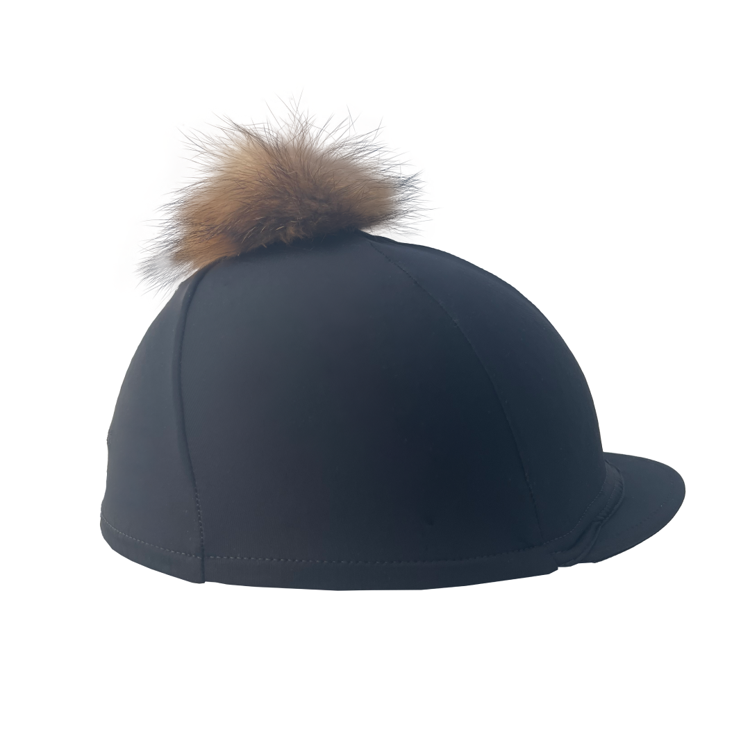 Black riding helmet with a brown fur pom-pom on a white background