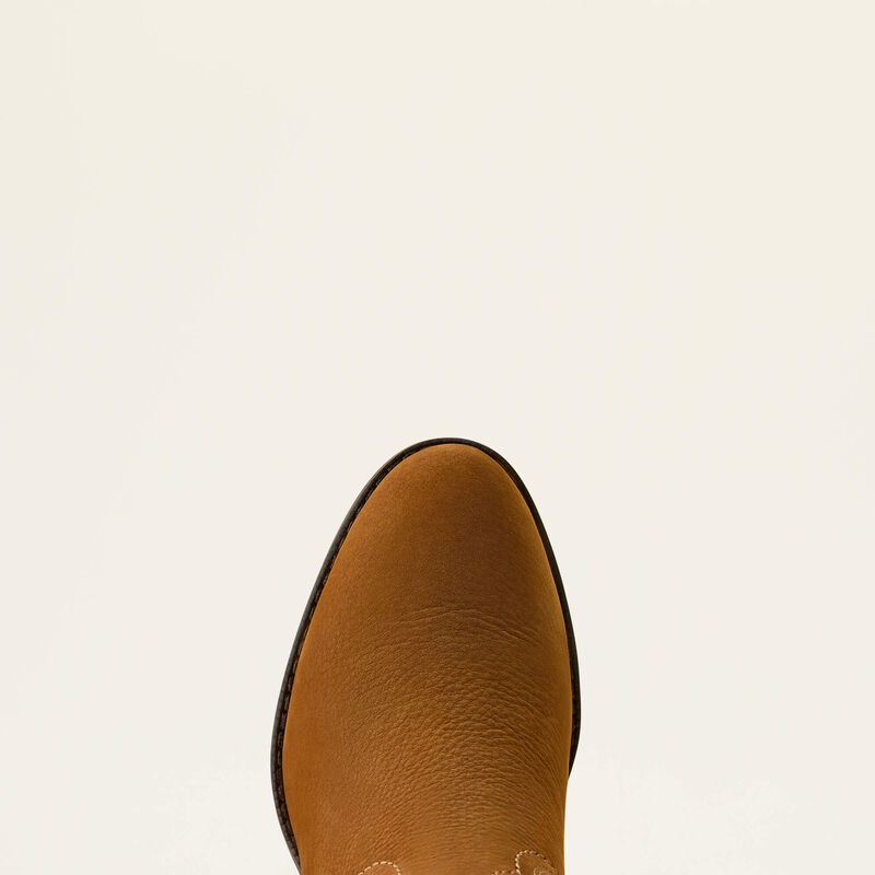Close-up top-down view of a brown leather boot toe against a plain off-white background.