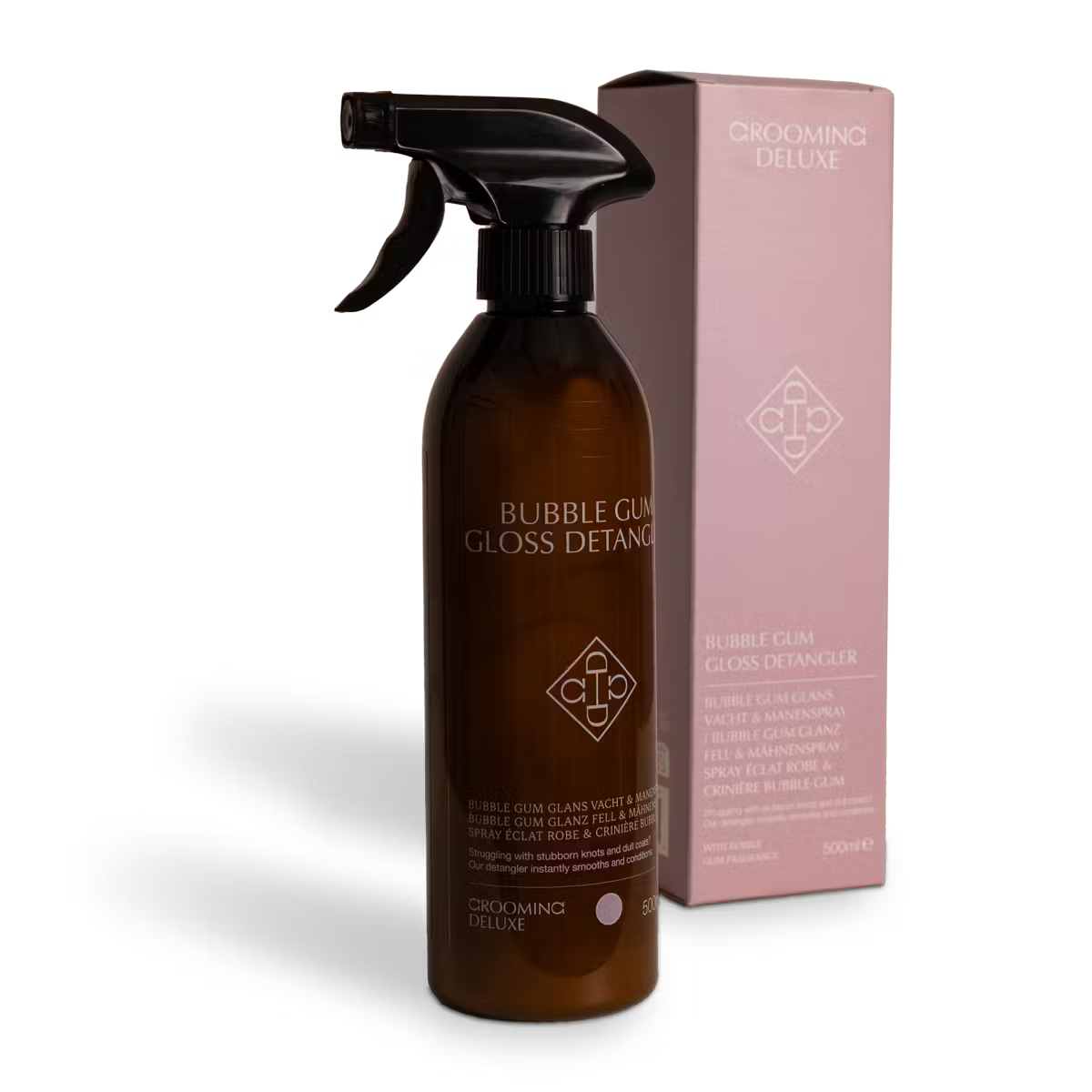 Brown spray bottle with black nozzle and pink box labeled 'Grooming Deluxe' on a white background