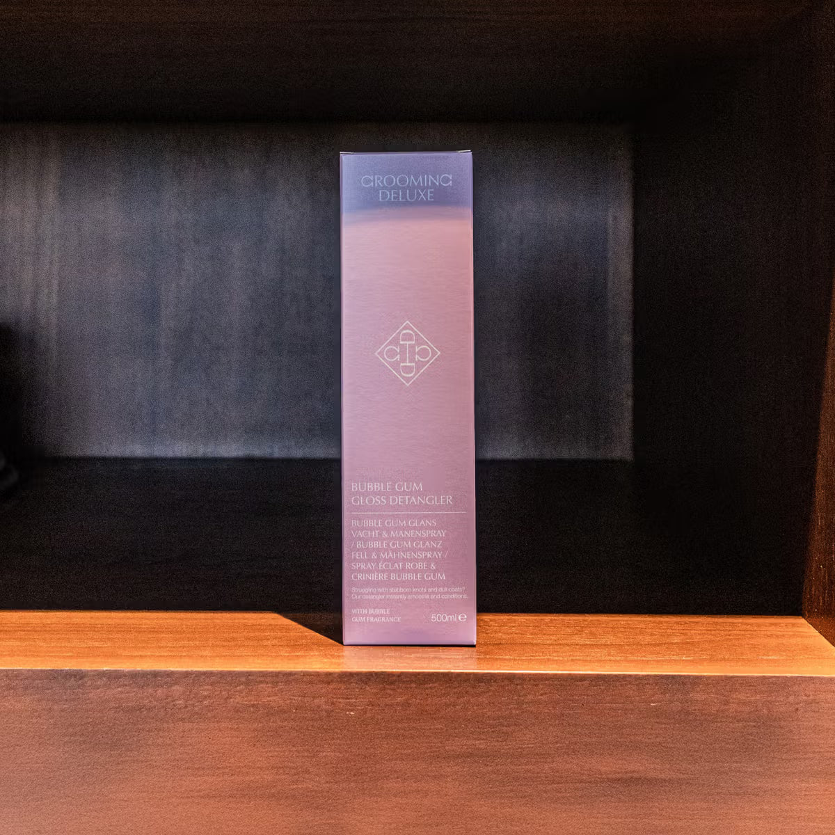Purple skincare product box on a wooden surface with a dark background