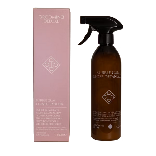 Grooming Deluxe Bubble Gum Gloss Detangler bottle and packaging on a black background