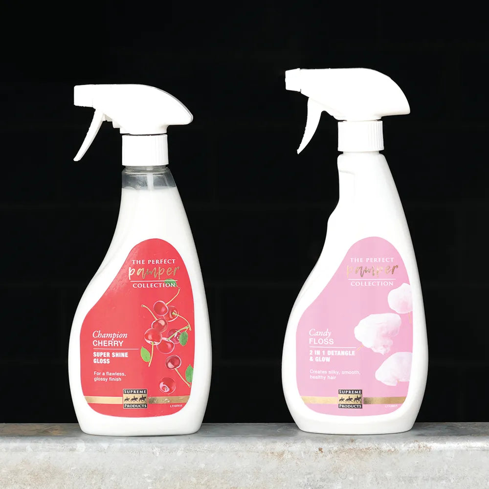 Two spray bottles with cherry-themed labels on a dark background