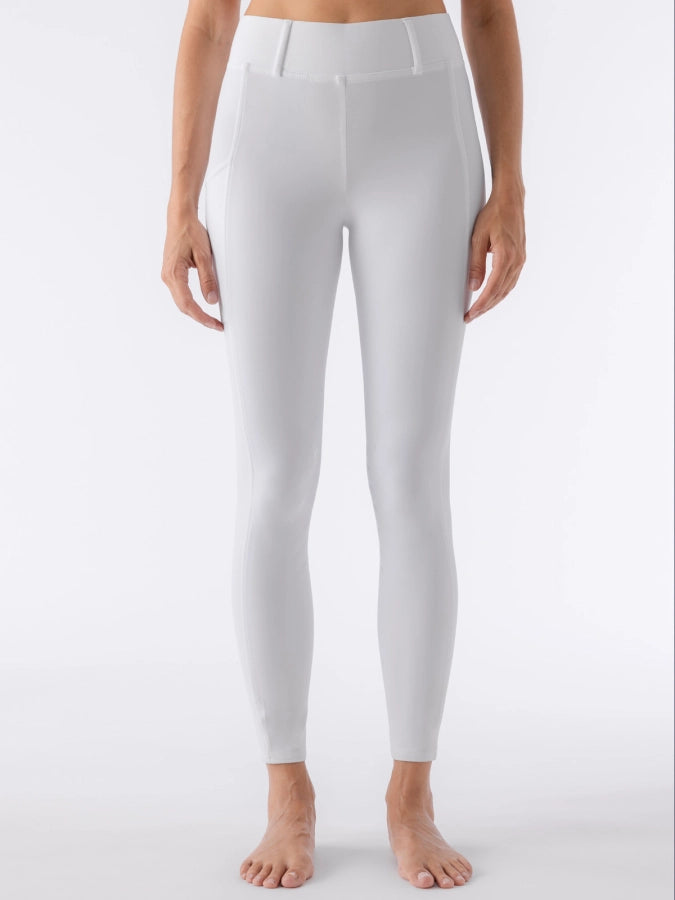 White leggings worn by a person on a white background