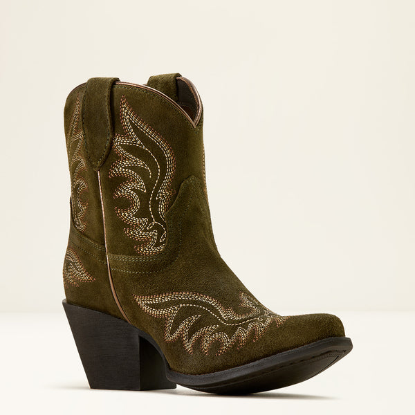 Brown cowboy boot with intricate stitching on a beige background
