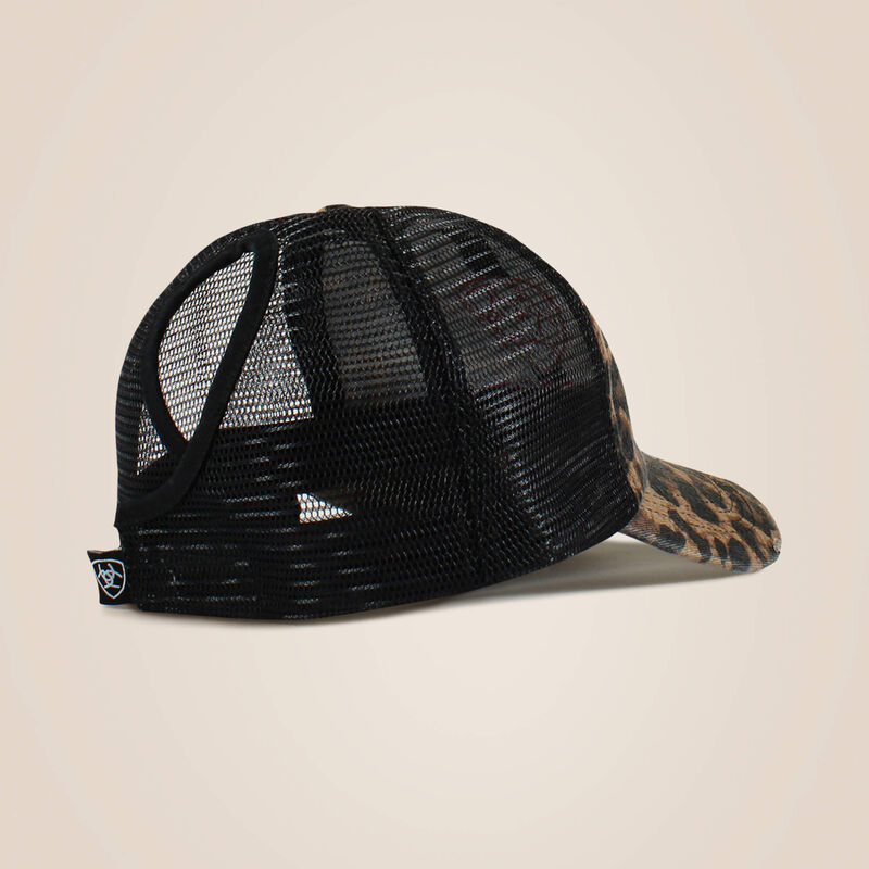 Black mesh cap with leopard print brim on a beige background