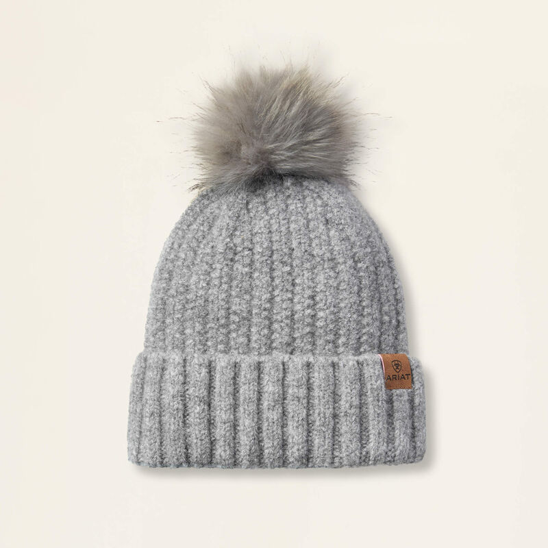 Grey beanie on a beige background